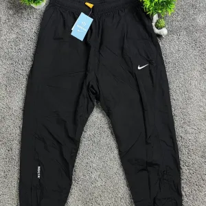 Нейлонові штани Nike Nocta
