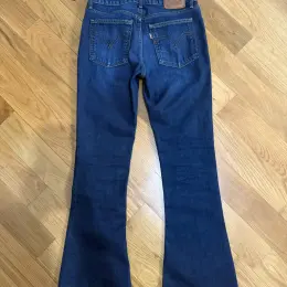 Джинси Levi's Premium Low Slim Boot сині 34 розмір